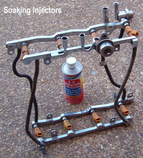 1994 Ford Crown Victoria - The '00 injectors seem to be getting clogged, so I got another set from the junkyard & installed them into these 2 fuel rails to soak for a…