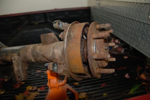 1996 Ford Bronco - This heavily rusted rear axle assembly is a vehicle part, not a complete vehicle.