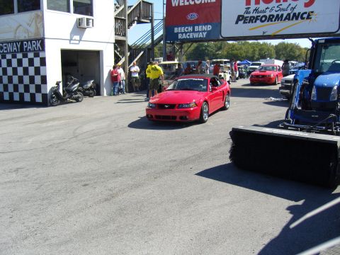 2007 Ford Mustang - Red convertible Mustang at Beech Bend Raceway with a track sweeper in the foreground.
