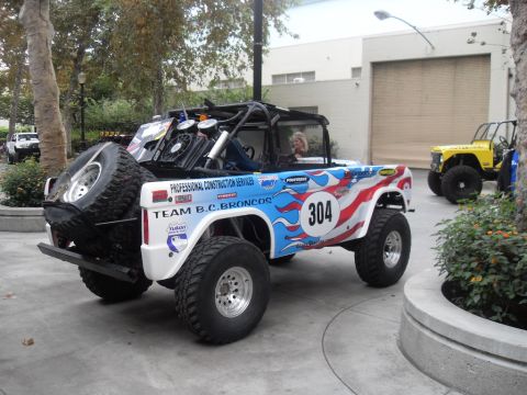 1990 Ford Bronco - This heavily modified Ford Bronco features custom patriotic and flame graphics, along with racing numbers.