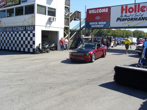 2007 Ford Mustang - A red and black 2007 Ford Mustang is seen at Beech Bend Raceway Park.