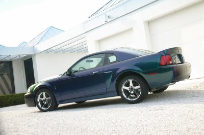 2004 Ford Mustang - 2004 Ford Mustang coupe with a spoiler, seen from the front three-quarter angle.