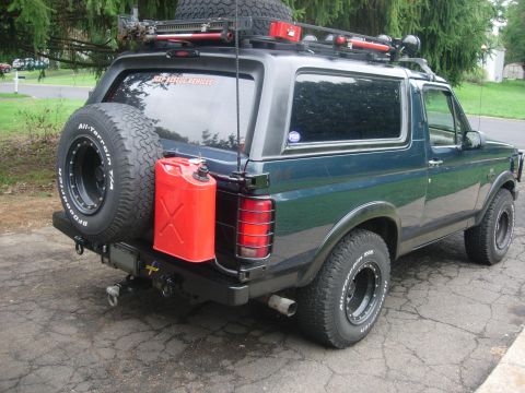 1993 Ford Bronco - This 1993 Ford Bronco is equipped for off-road adventures with a spare tire, jerry can, and roof rack.