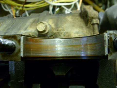 1988 Ford Bronco - Close-up of a worn engine bearing, likely from a Ford Bronco's 351 engine.
