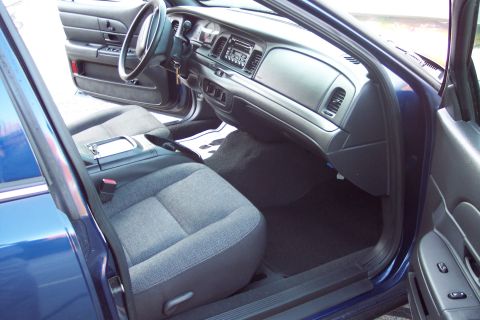 2001 Ford Crown Victoria - Interior view of a car's passenger seat and dashboard, seen from the driver's side.