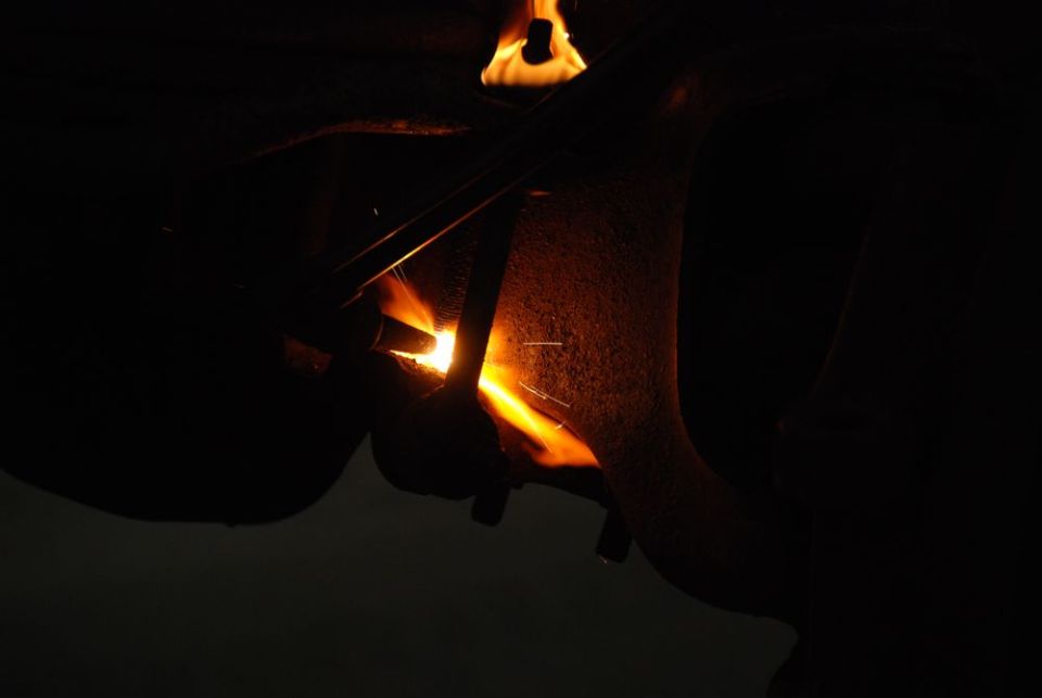 welding torch heating metal part