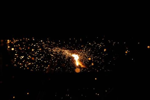 1996 Ford Bronco - A sparkler creates a burst of light and sparks in the dark.