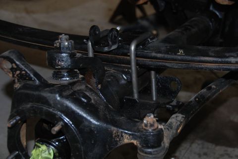 1996 Ford Bronco - This image shows a close-up view of a vehicle's suspension system, focusing on the ball joint and related components.