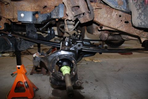 1996 Ford Bronco - Vehicle frame and suspension components are visible, with some parts showing rust and others recently painted black.