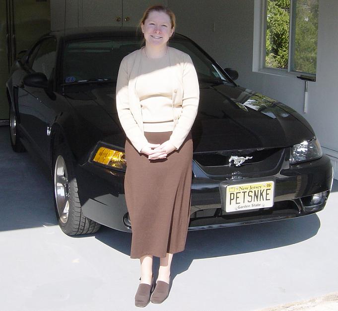 Black 2001 Ford Mustang with a New Jersey license plate reading PETSNKE