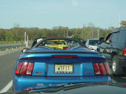 2001 Ford Mustang - A blue 2001 Ford Mustang convertible, identified as a Saleen model, is seen in traffic.