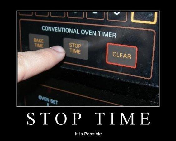 Finger pressing STOP TIME button on an oven timer, meme