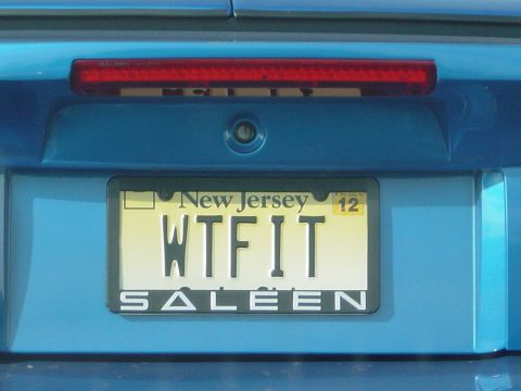 2001 Ford Mustang - Rear view of a blue car with a custom license plate and frame.