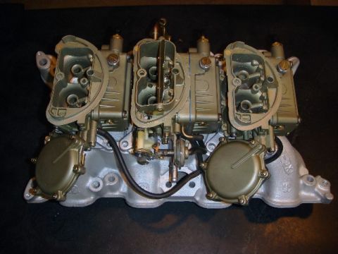 1972 Ford Ranchero - A tri-carburetor intake manifold assembly, likely for a performance application, is shown against a dark background.