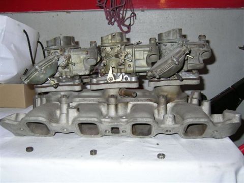1972 Ford Ranchero - A close-up view of a triple carburetor intake manifold, likely for a performance engine.