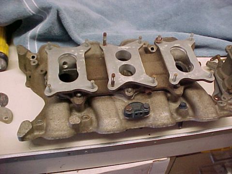 1972 Ford Ranchero - This intake manifold features three distinct mounting plates for carburetors, suggesting a performance-oriented setup.
