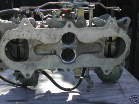 1972 Ford Ranchero - Carburetor assembly with linkage and hoses, likely for a V8 engine.