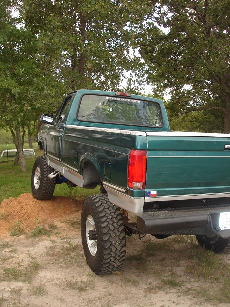1996 Ford F-150 - Green 1996 Ford F-150 pickup truck with custom lift kit and oversized tires.