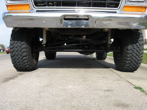 1979 Ford Bronco - Front view of a 1979 Ford Bronco showing its suspension and large tires.