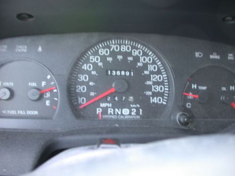 2000 Ford Crown Victoria - Close-up of a car's dashboard gauges, including the speedometer and odometer.