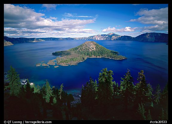 View of Crater Lake and Wizard Island with trees in foreground