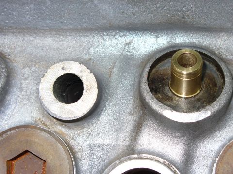 1971 Toyota Corolla - Engine cylinder head detail, focusing on a valve guide and a threaded opening.