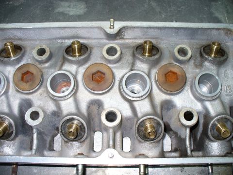 1971 Toyota Corolla - This is a close-up view of an engine's cylinder head, showing various components and openings.
