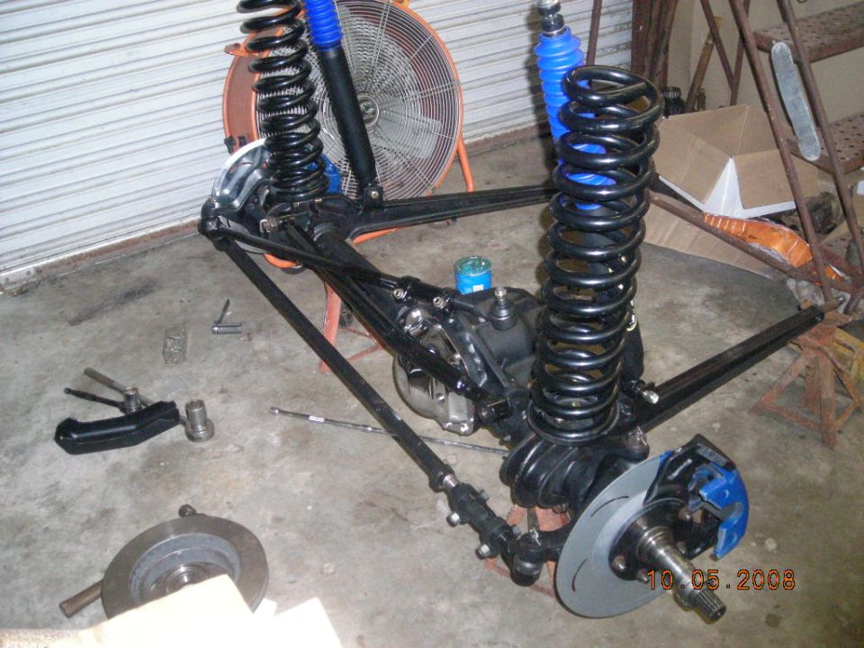 Front suspension assembly with blue shocks and disc brakes