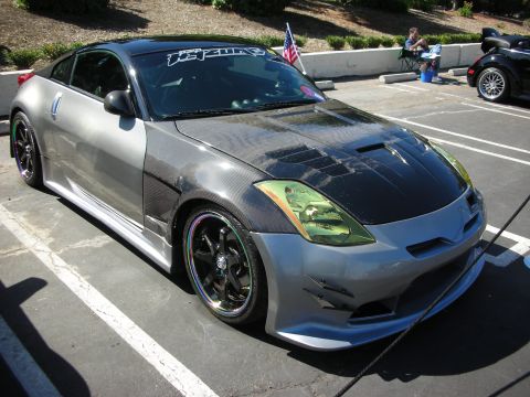 1998 Ford Crown Victoria - Customized Nissan 350Z on display at a car show, aftermarket body modifications and wheels.