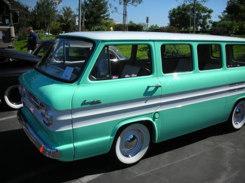 1998 Ford Crown Victoria - A vintage Chevrolet van is parked outdoors, showing its distinctive two-tone paint scheme and chrome accents.