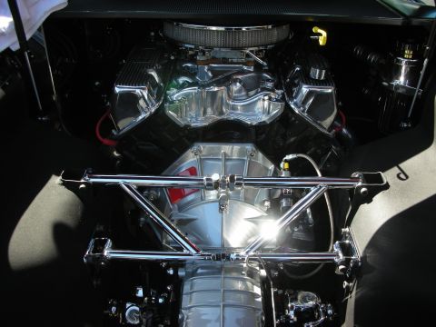 1998 Ford Crown Victoria - Engine bay view of a highly polished V8 engine with chrome accents.