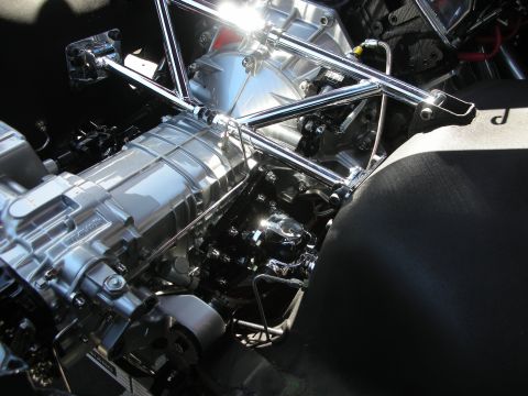 1998 Ford Crown Victoria - The engine bay features a highly polished engine and transmission, with chrome structural supports.