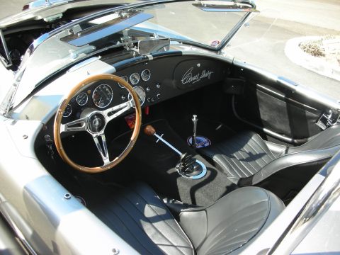 1998 Ford Crown Victoria - Interior of a classic sports car, likely a Shelby Cobra, showing the dashboard and seats.