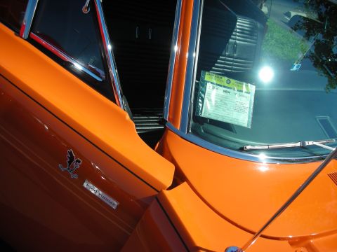 1998 Ford Crown Victoria - Orange muscle car interior and fender detail with 'Road Runner' badge.