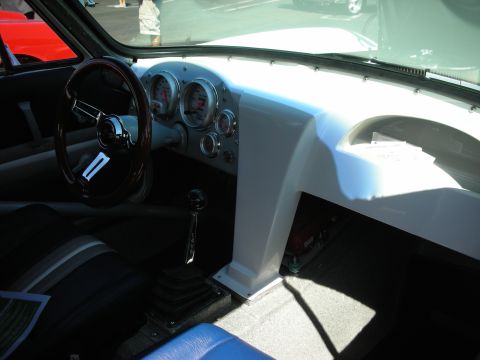 1998 Ford Crown Victoria - The dashboard features multiple gauges and a custom center console, with a manual transmission shifter visible.