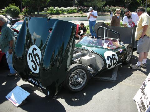 1998 Ford Crown Victoria - A green race car with its hood open, displaying the number 36 on its side and hood, at a car show.