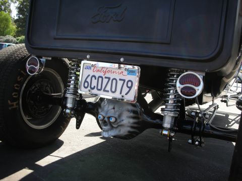 1998 Ford Crown Victoria - Custom rear axle features a skull design, complementing the California license plate.