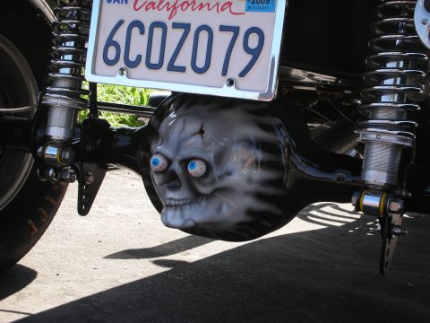 1998 Ford Crown Victoria - A custom painted skull adorns the rear differential cover of a vehicle, complete with wide-eyed stare.