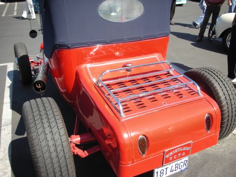 1998 Ford Crown Victoria - This red hot rod features a luggage rack and a custom license plate.