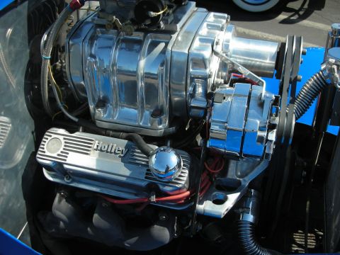 1998 Ford Crown Victoria - Close-up of a highly polished engine component assembly with visible "Holley" branding.