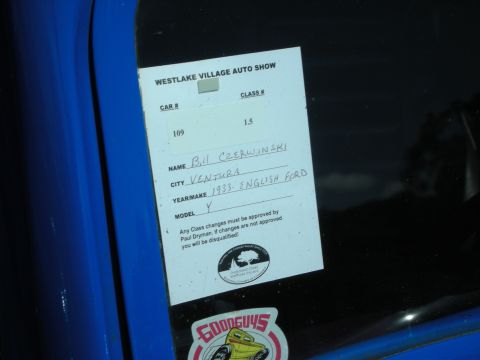 1998 Ford Crown Victoria - A car show registration document lists the vehicle as a 1933 English Ford, contradicting the registry's claim of a 1998 Ford Crown Victoria.
