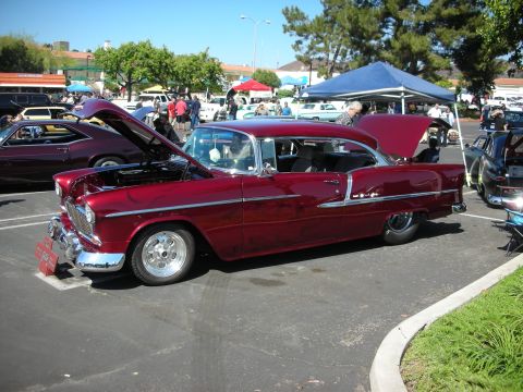 1998 Ford Crown Victoria - Custom 1955 Chevrolet Bel Air coupe on display at a car show event.