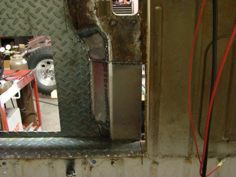 1948 Jeep Wrangler - Close-up view of diamond plate and freshly welded metal panels within the interior of a vehicle.