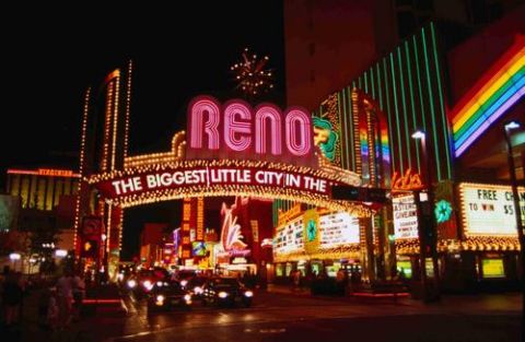 1974 Ford Ranchero - The iconic Reno Arch illuminates the night sky, with casinos and traffic visible below.