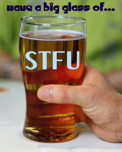 2001 Ford Mustang - A glass of beer with the acronym STFU printed on it, held by a person's hand.