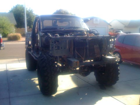 1994 Ford Bronco - This 1994 Ford Bronco is missing its engine and hood, showing its chassis and front suspension.