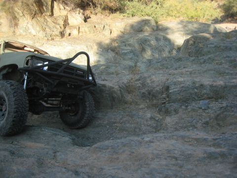 1985 Toyota 4Runner - Modified 1985 Toyota 4Runner navigating rocky terrain off-road.