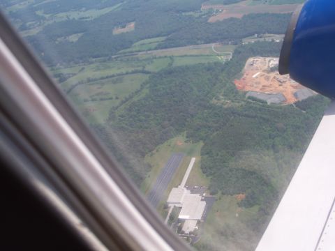 1971 Ford Ranchero - View from an airplane window shows a landscape with an airport and a construction site below.