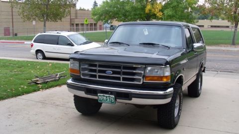 1996 Ford Bronco - This 1996 Ford Bronco is shown in a front 3/4 view, its chrome grille and prominent tires.