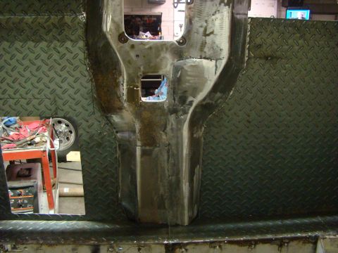 1948 Jeep Wrangler - Close-up view of a vehicle's chassis being repaired, showing metalwork and diamond plate.